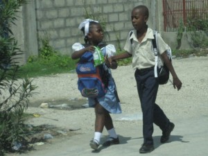 The Jean Robert Cadet Restavek Organization is working hard to keep families intact and enable little sisters to walk hand-in-hand with their big brothers home from school.