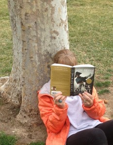 Reading "Black Count," by Tom Reiss under a tree